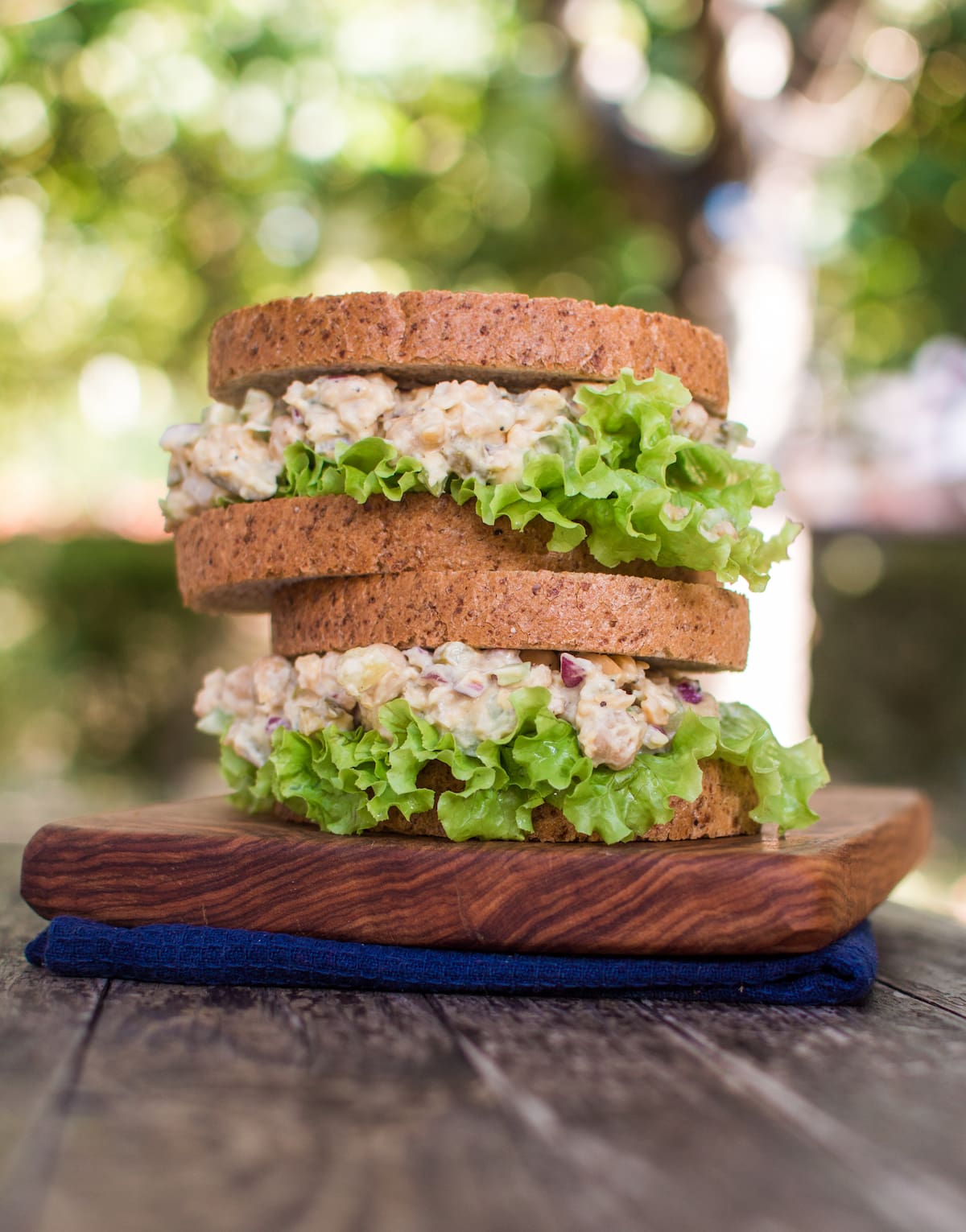 Vegan chicken salad served in a sandwich with lettuce, a refreshing complement to vegan picnic ideas.