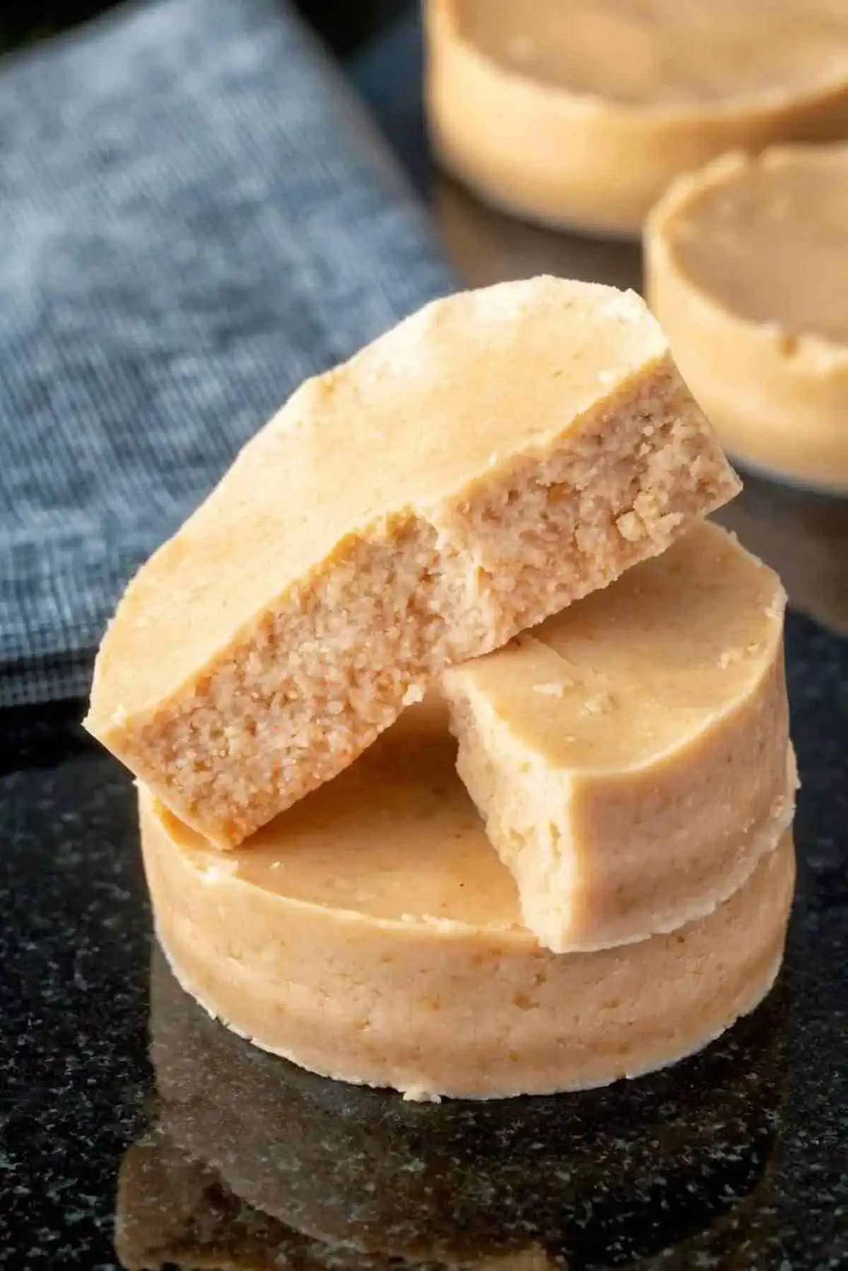 Vegan Mazapan pieces in a stack with one sliced in half.