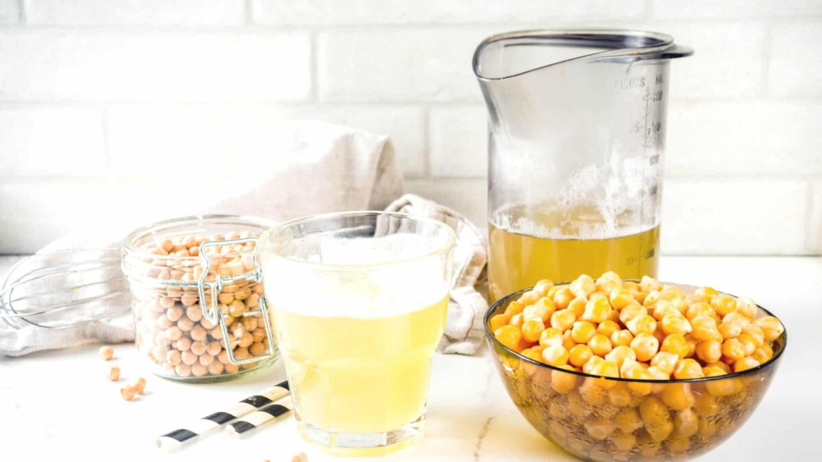 Chickpea brine and chickpeas on a countertop.