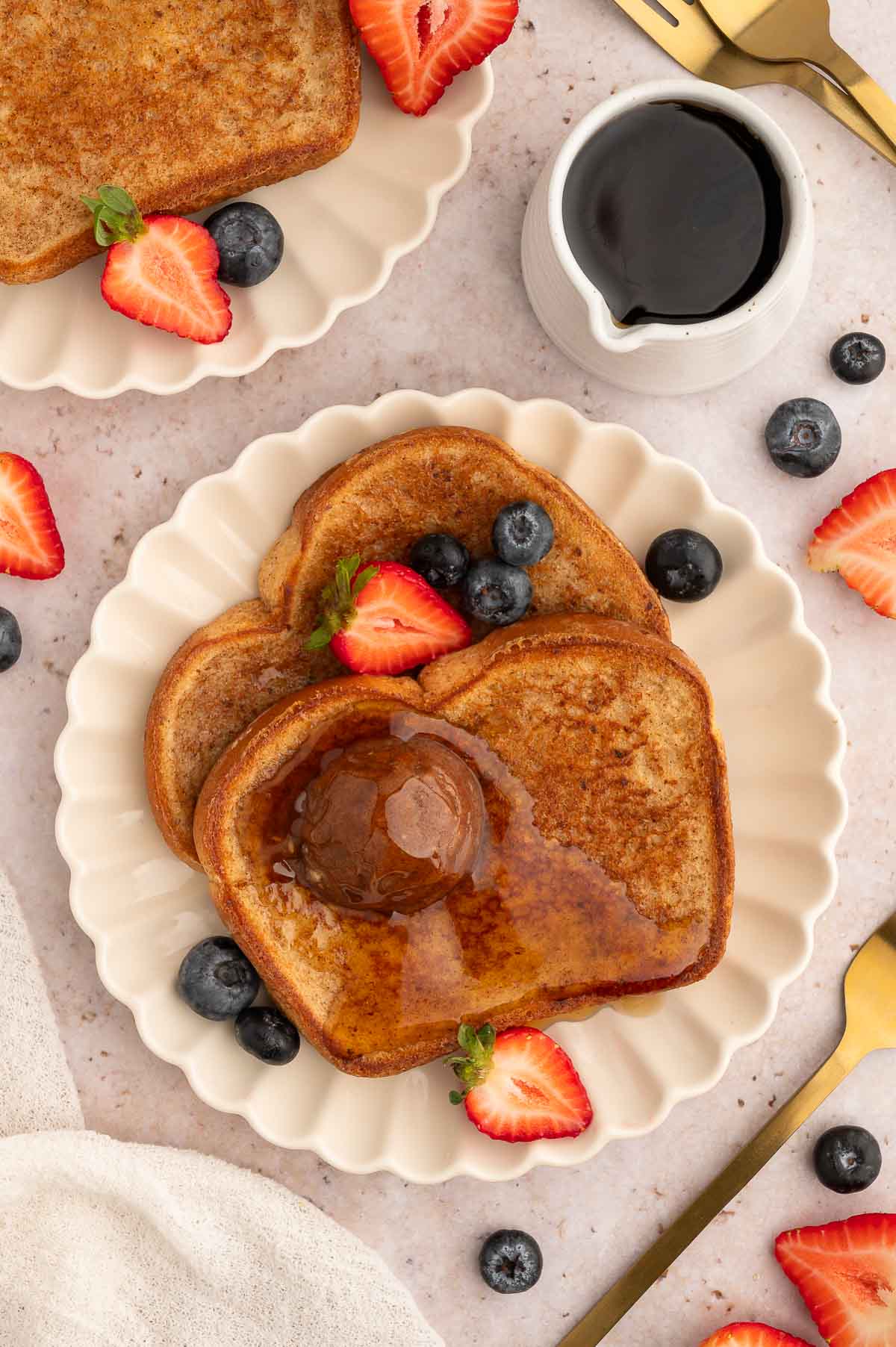 Vegan French toast served with fruit and Nutella.