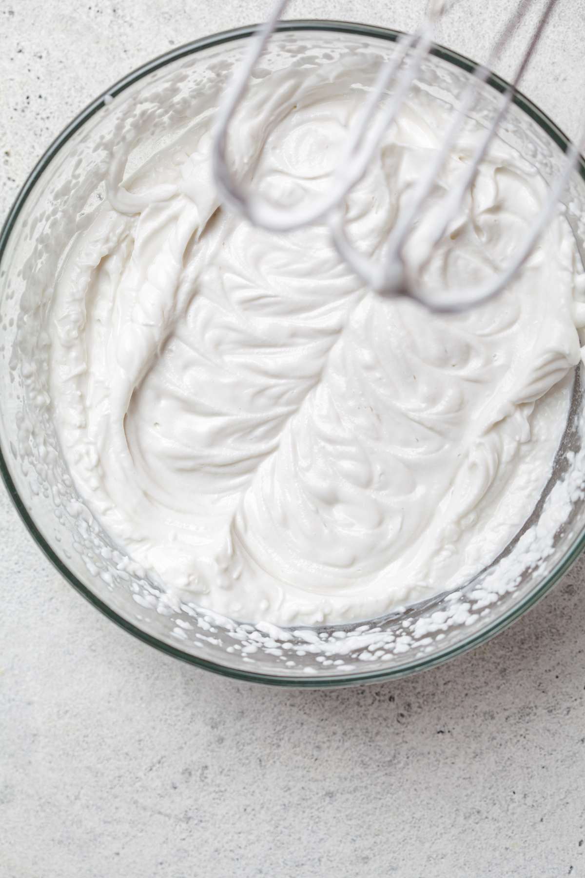 Whipped vegan cream in a mixing bowl.