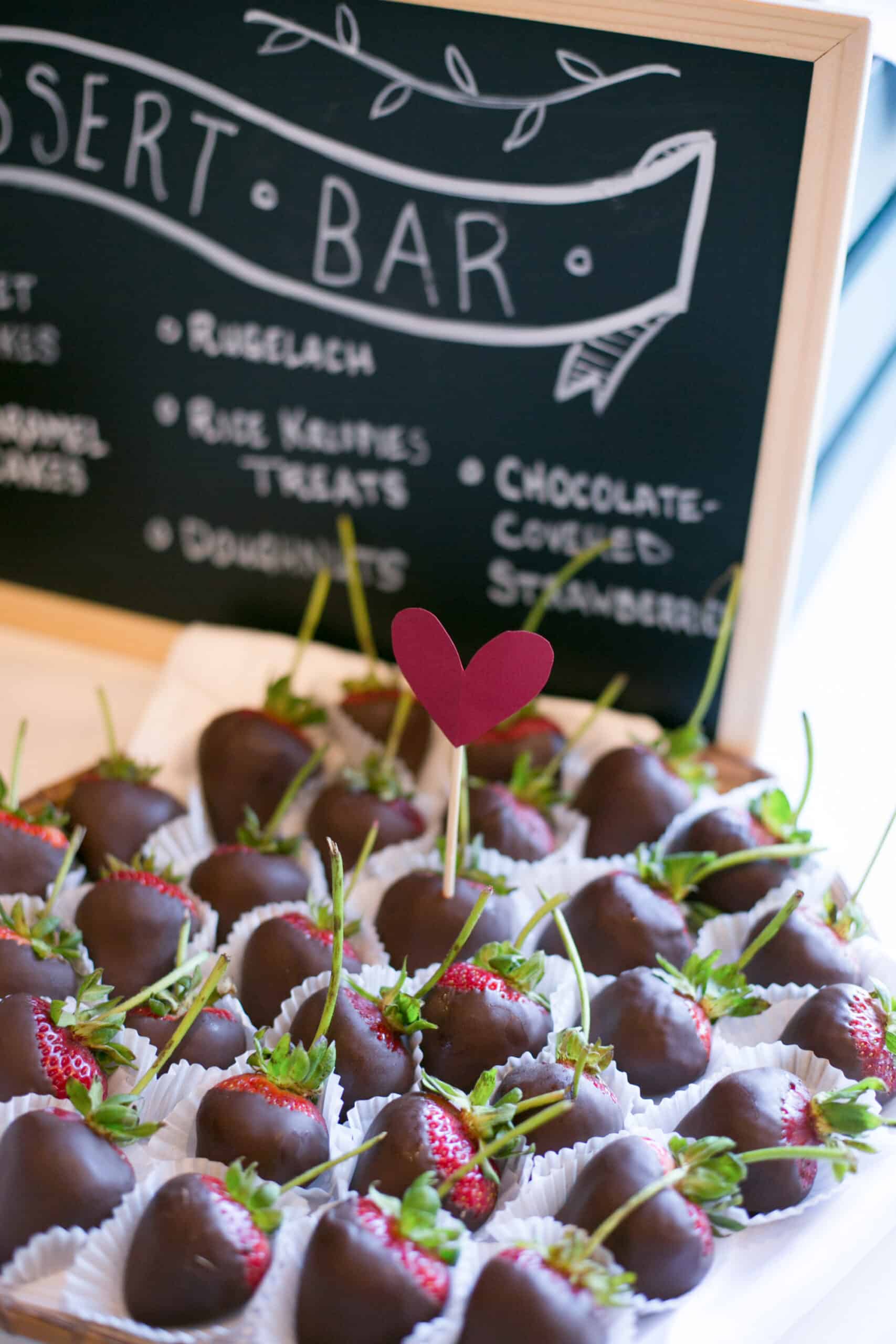 An arrangement of chocolate-covered strawberries at a vegan wedding reception.