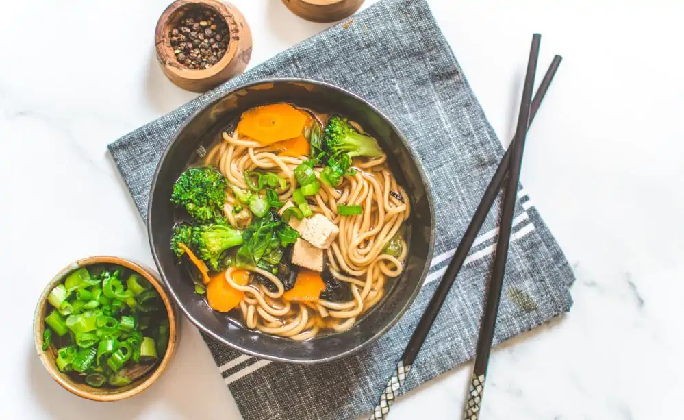 Miso Noodle Soup Bowl with Chop Sticks, Salt and Pepper on the Side