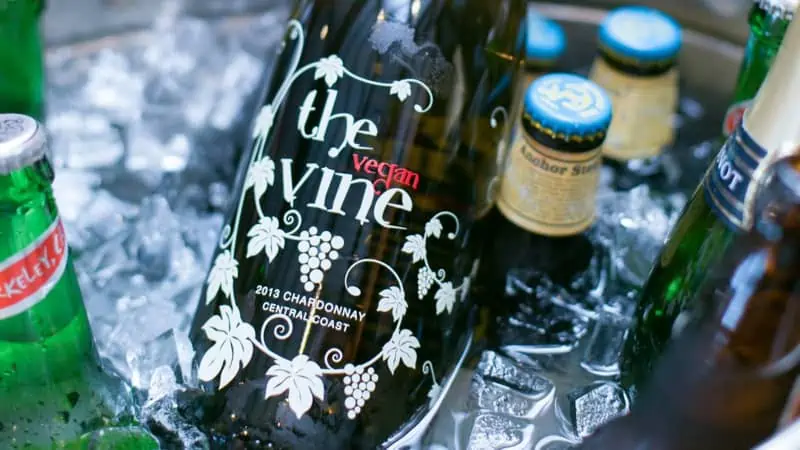 The vegan vine wine bottle in a cooler.