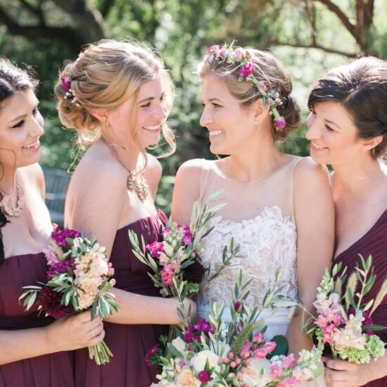 A bridge and her bridesmaids at a vegan wedding ceremony.