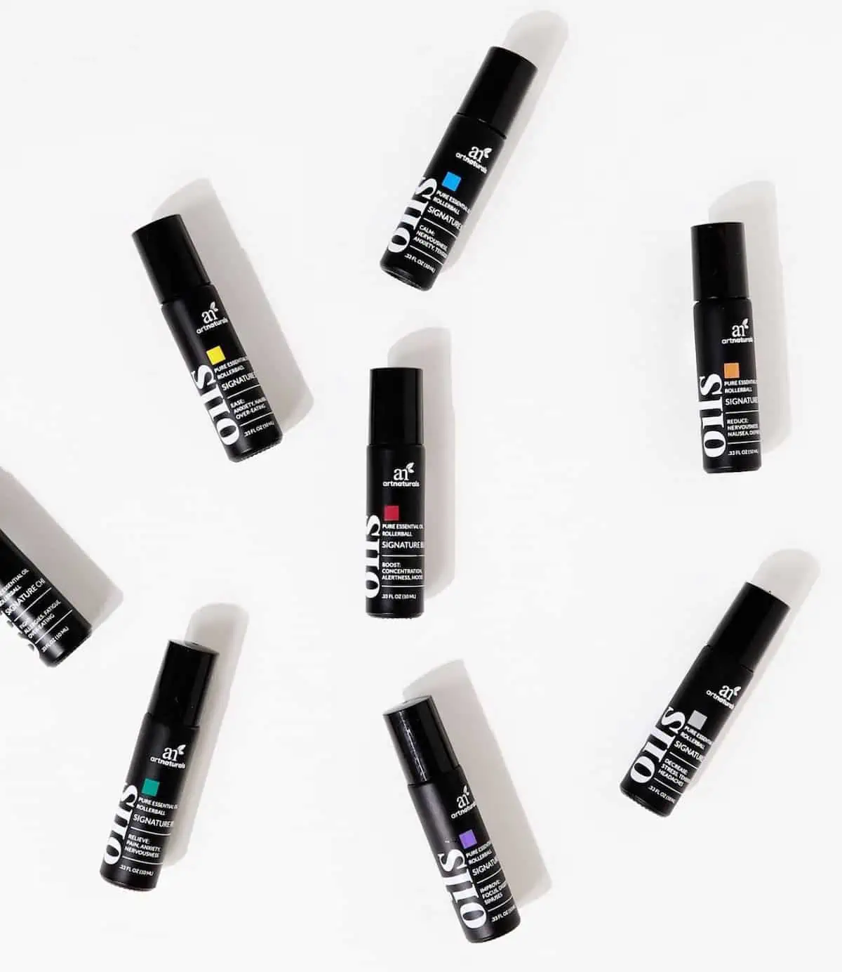 Essential oils roll-on applicators against a white background.