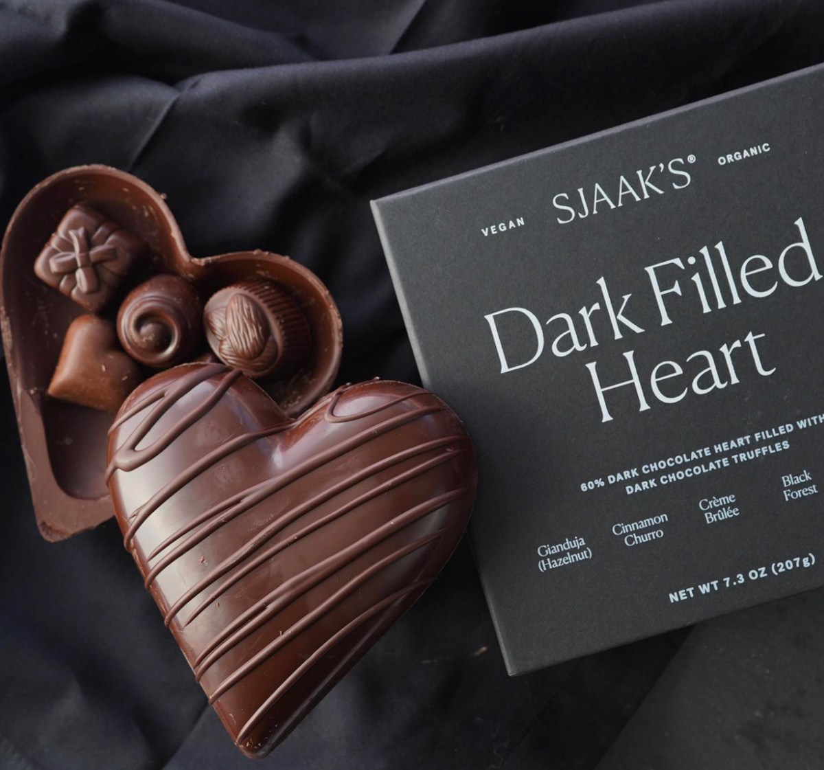 Chocolate heart filled with smaller dark chocolates.