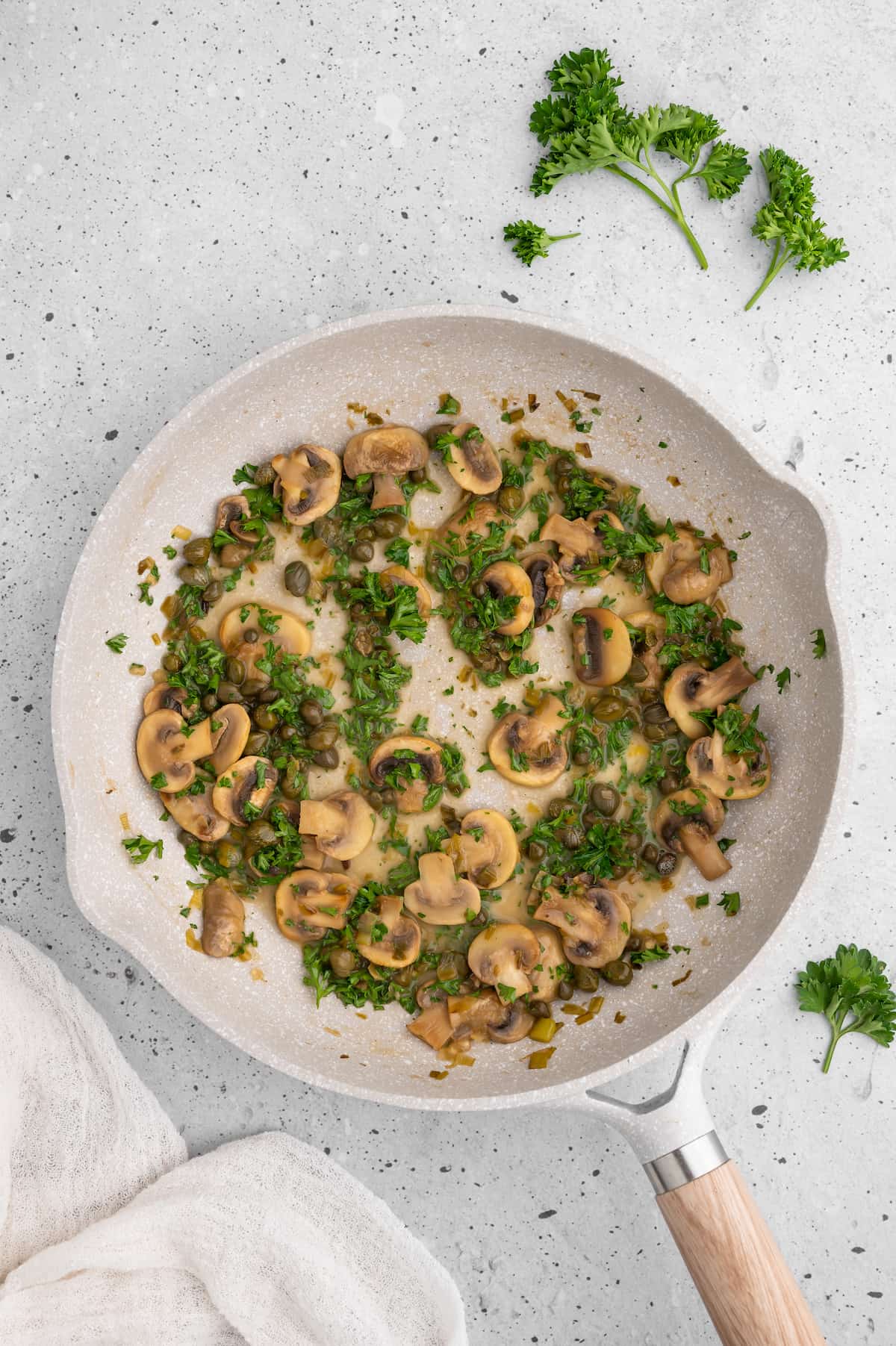 The piccata sauce with mushrooms, scallions, capers, lemon juice and wine.