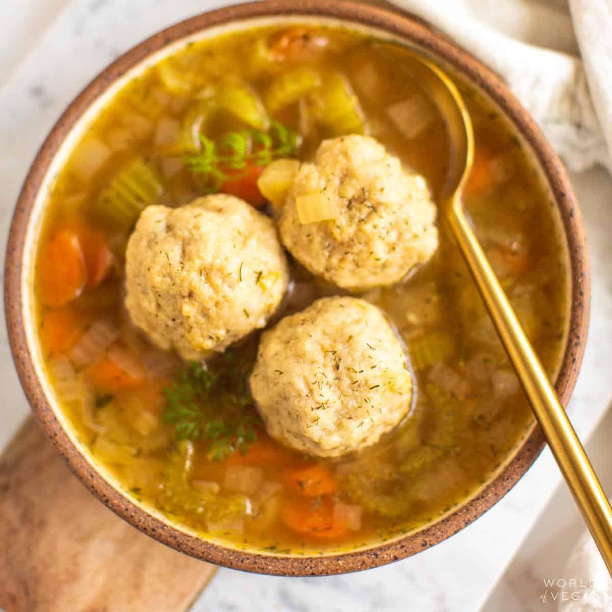 A rustic bowl of the best vegan matzo ball soup made with vegetarian broth.