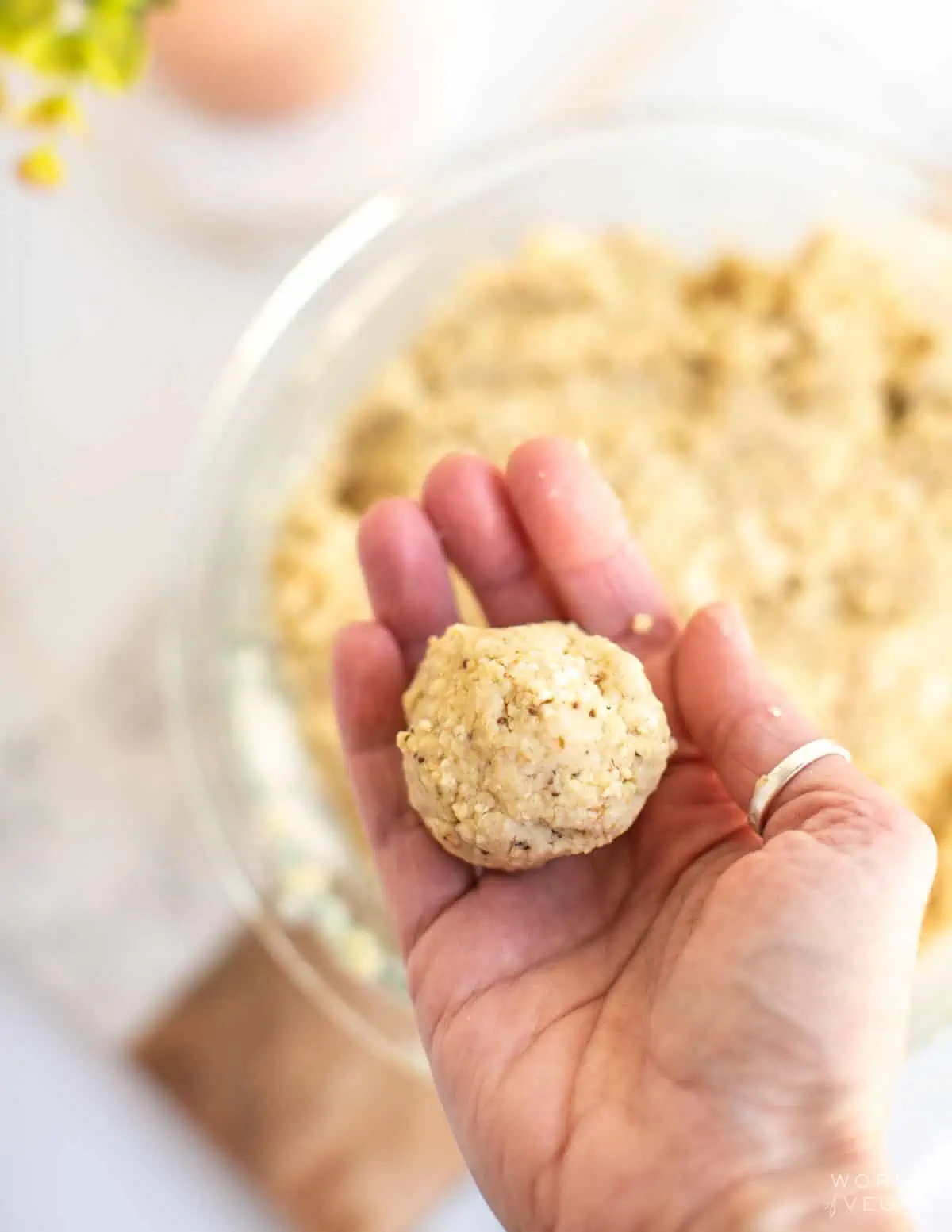 Showing how to shape matzo balls.