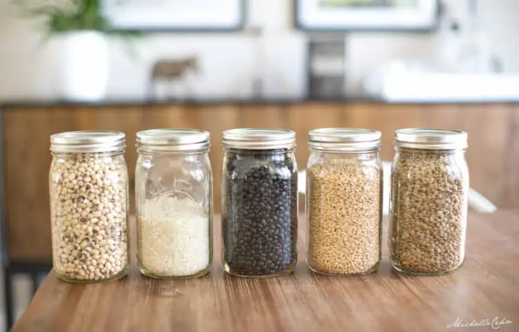 wide mouth mason jars filled with pantry staples