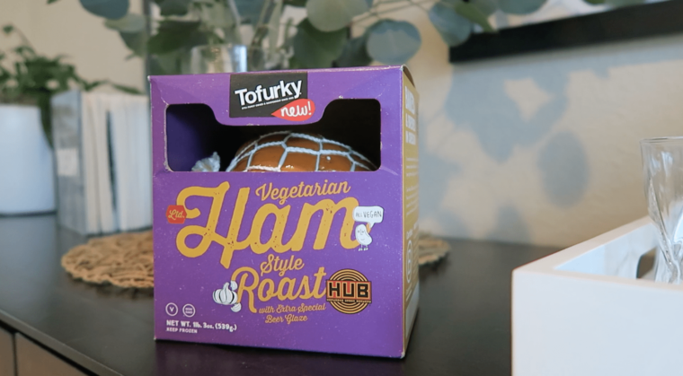 Box of Tofurky's vegan ham roast on a table. 