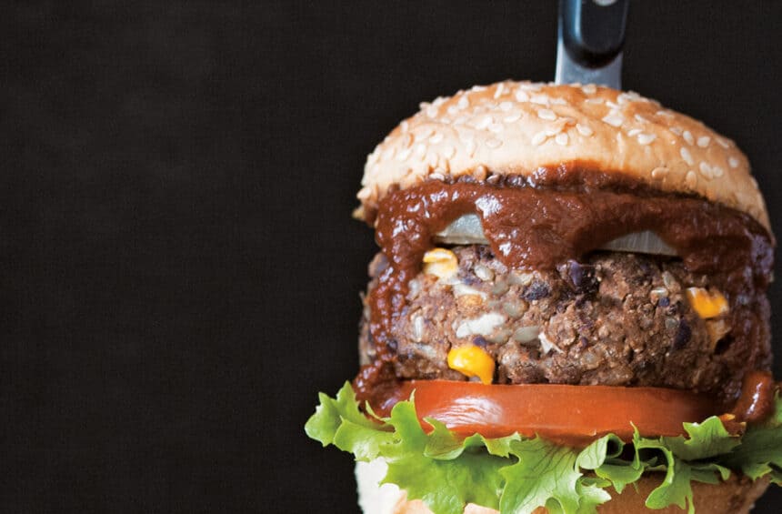 Vegan black bean burger with barbecue sauce.