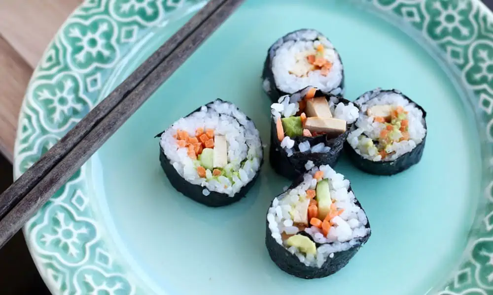 Vegan sushi rolls with vegetables, tofu, and avocado