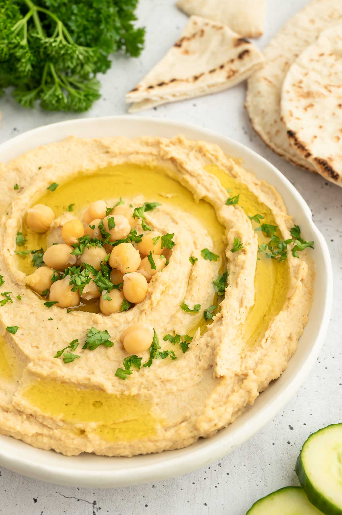 A bowl of hummus garnished with chickpeas.