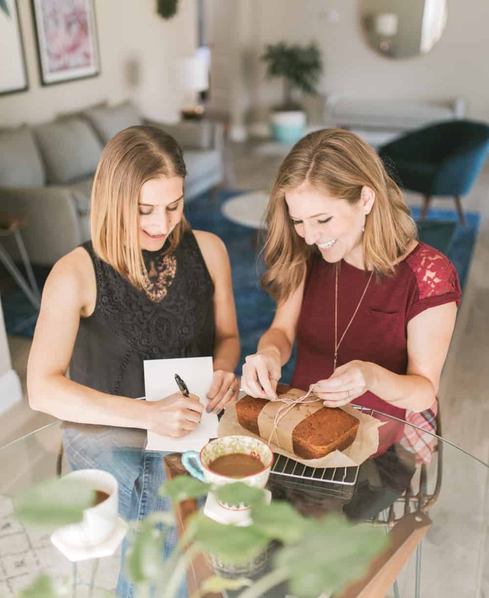 Michelle Cehn and Kristie Middleton Wrapping Homemade Pumpkin Bread and Writing Holiday Cards