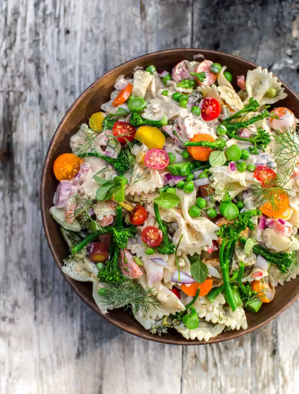 A colorful bowl of picnic pasta salad.