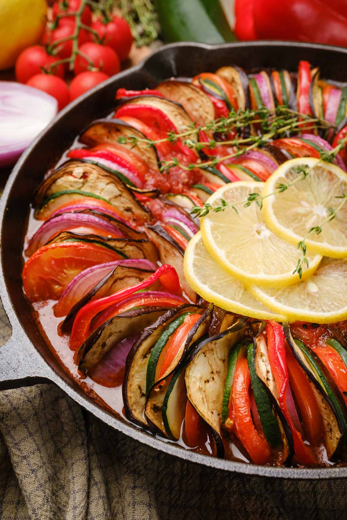 A side shot of ratatouille in a cast iron pan.