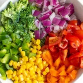 Bowl of diced veggies to use on rainbow pizza.