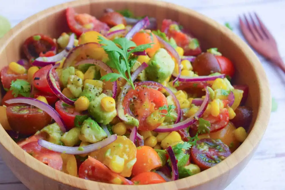 Summer corn and tomato salad in a serving bowl.