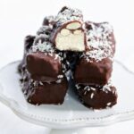 Homemade vegan Almond Joy candy bars on a plate.