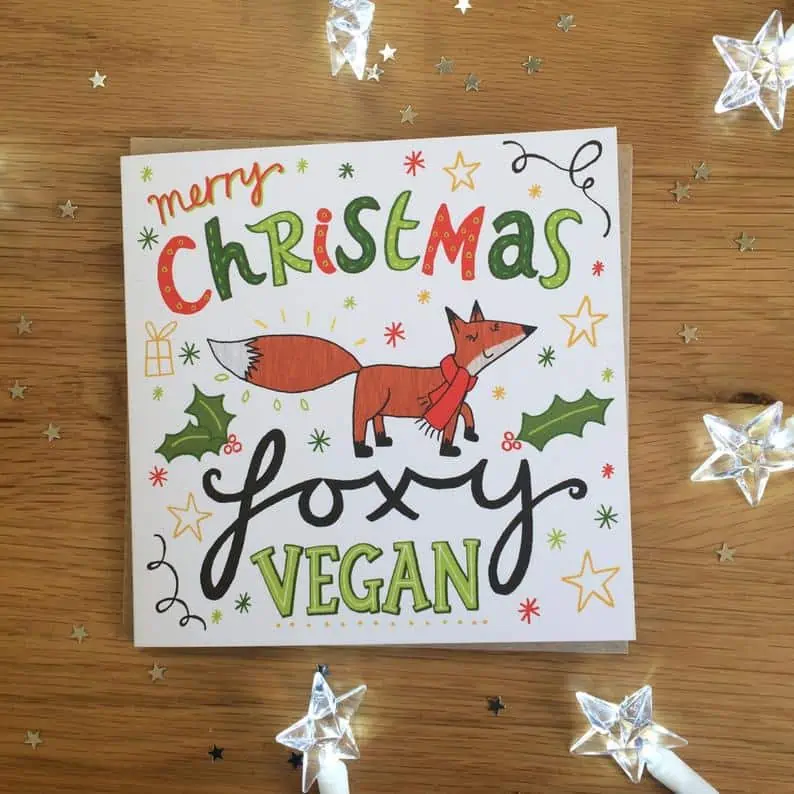 Vegan holiday card that says "Merry Christmas Foxy Vegan" on the front.