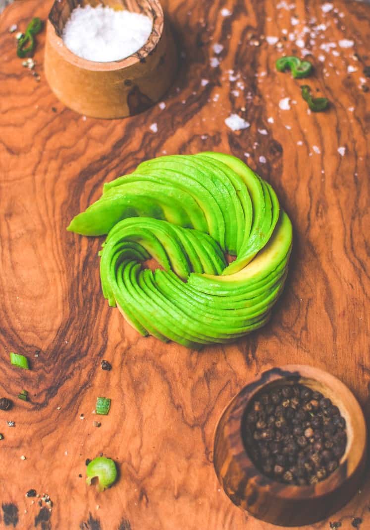 Avocado thinly sliced and in a spiral to look like a rose.