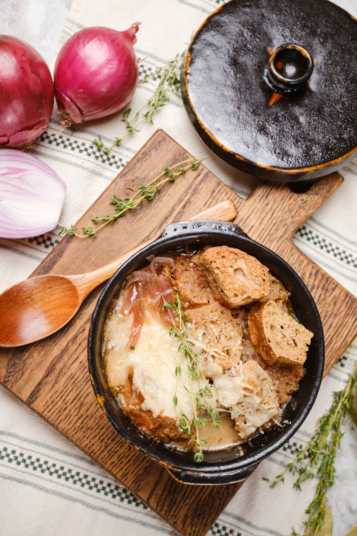 Vegan French Onion Soup on a tabletop.