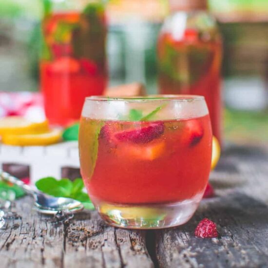 A glass of strawberry mint lemonade.