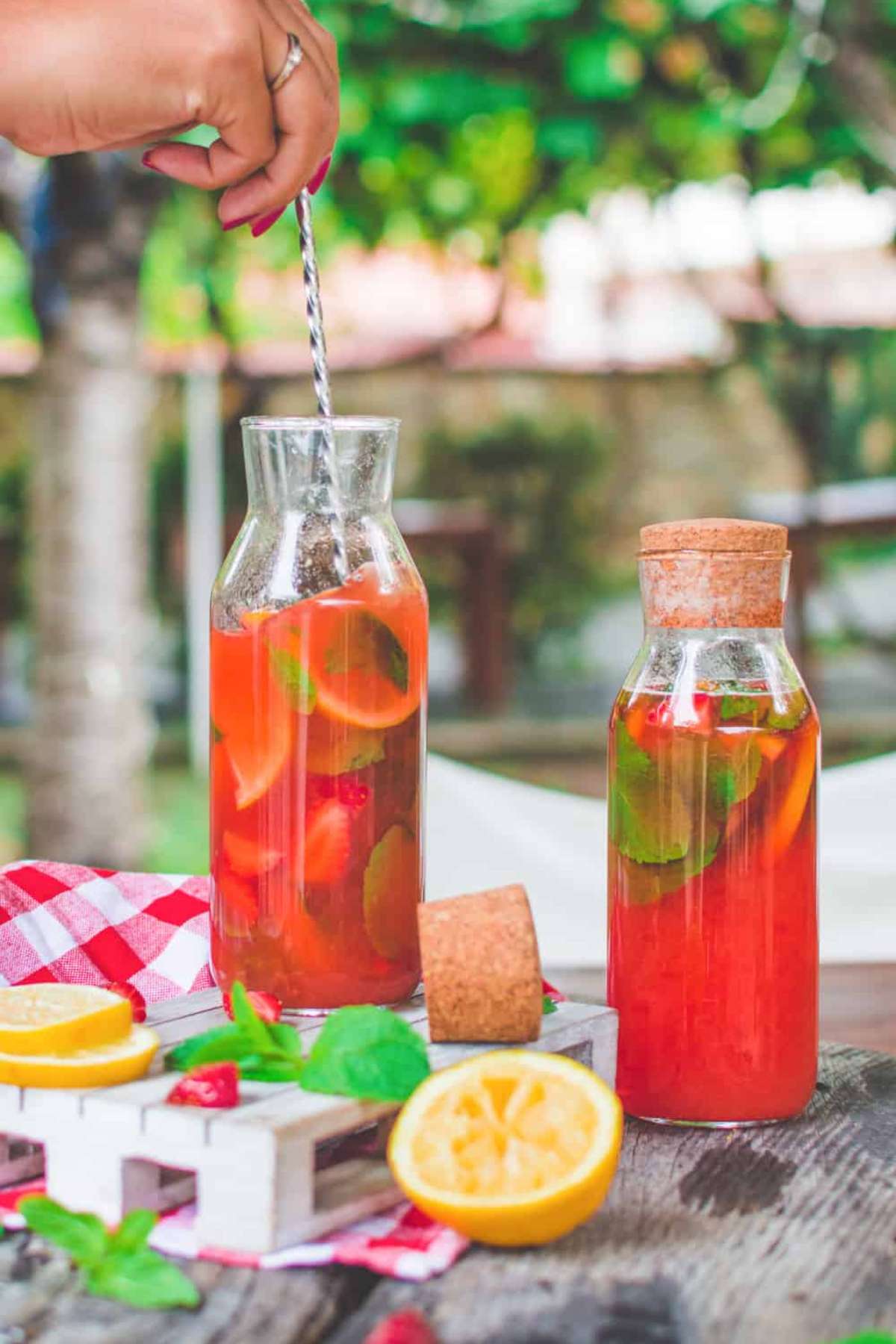 Two bottles of strawberry mint lemonade.