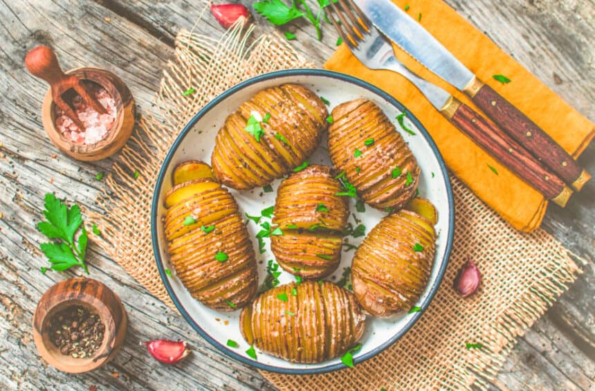 Vegan Hasselback Potatoes served on a table