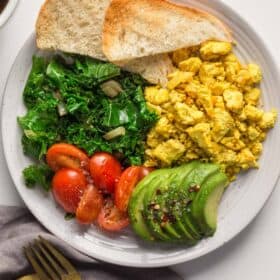 Plated tofu scramble with toast instead of eggs.