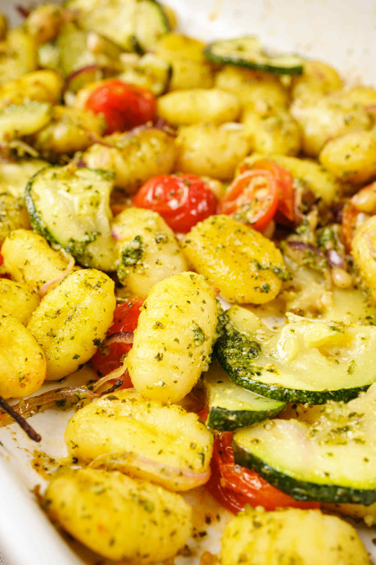 Gnocchi pesto in the casserole dish after baking.