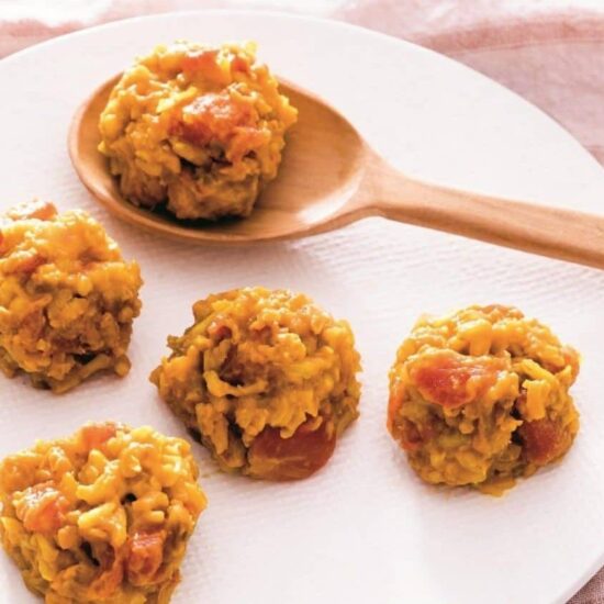 rice and lentil khichdi on a wooden spoon