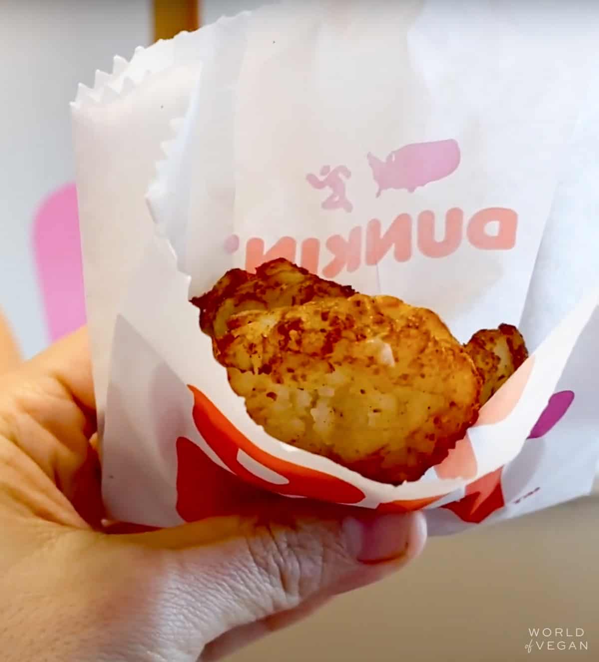 vegan hash browns in a paper bag from dunkin donuts
