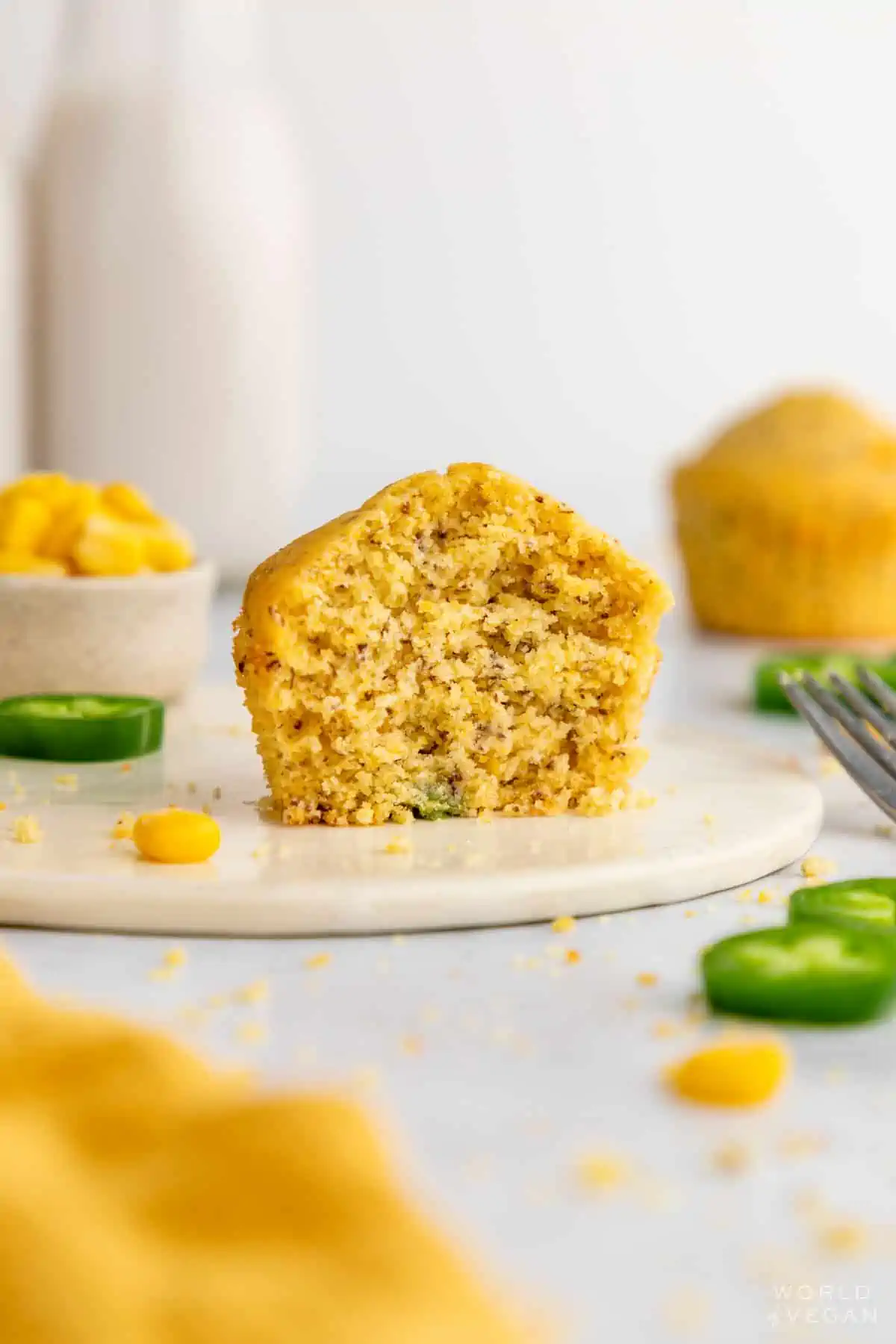 Sliced open inside of a vegan jalapeno cornbread muffin. 