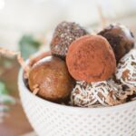 A close-up shot of date truffles in a bowl.