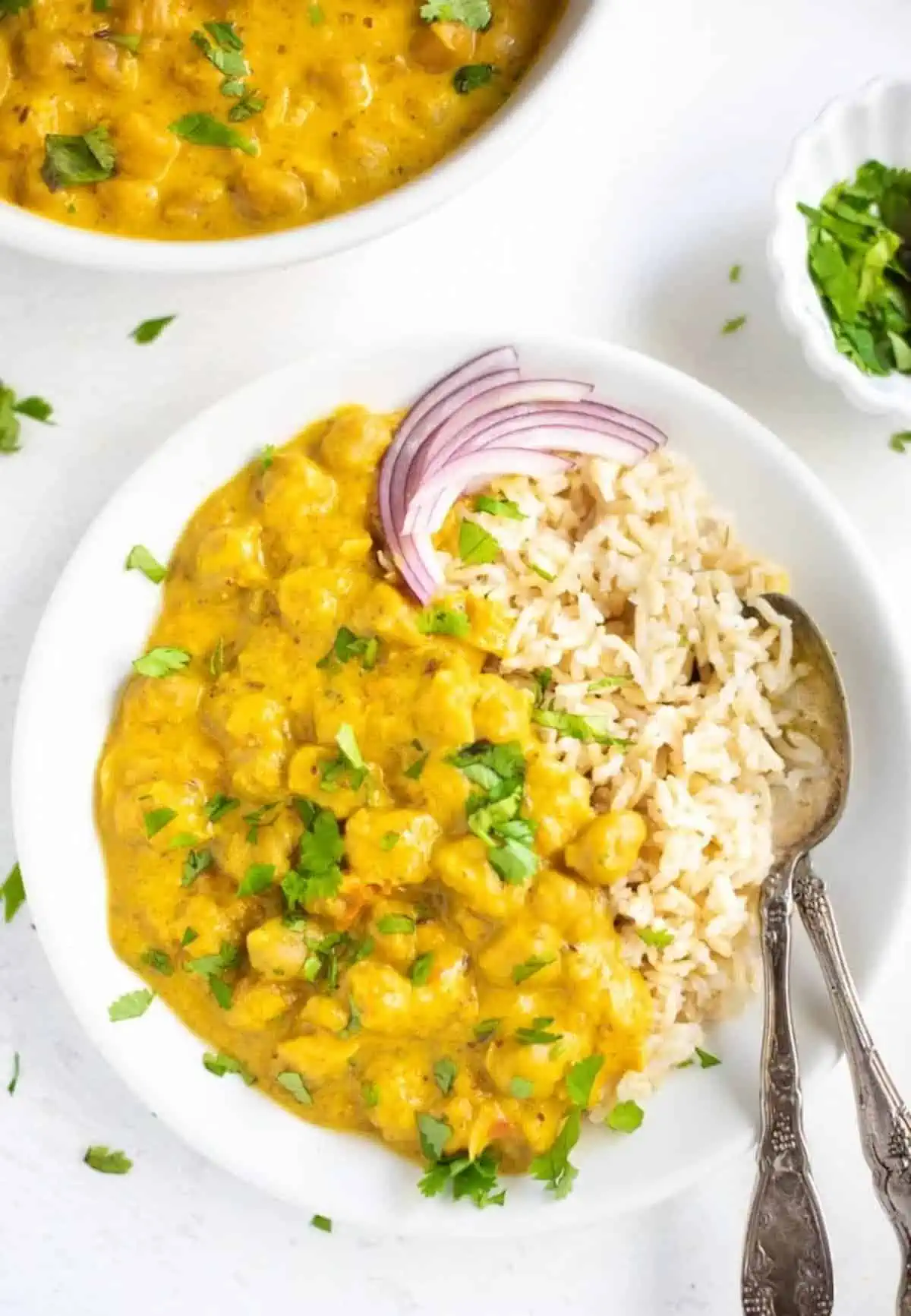 https://www.worldofvegan.com/wp-content/uploads/2021/01/Coconut-Chickpea-Curry-Instant-Pot-Piping-Pot-Curry.webp