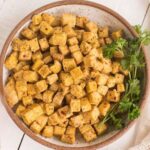A bowl of air fryer tofu nuggets.