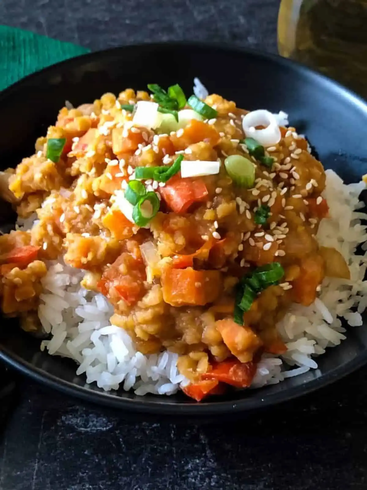 A bowl of Korean-flavored red lentils served over rice.