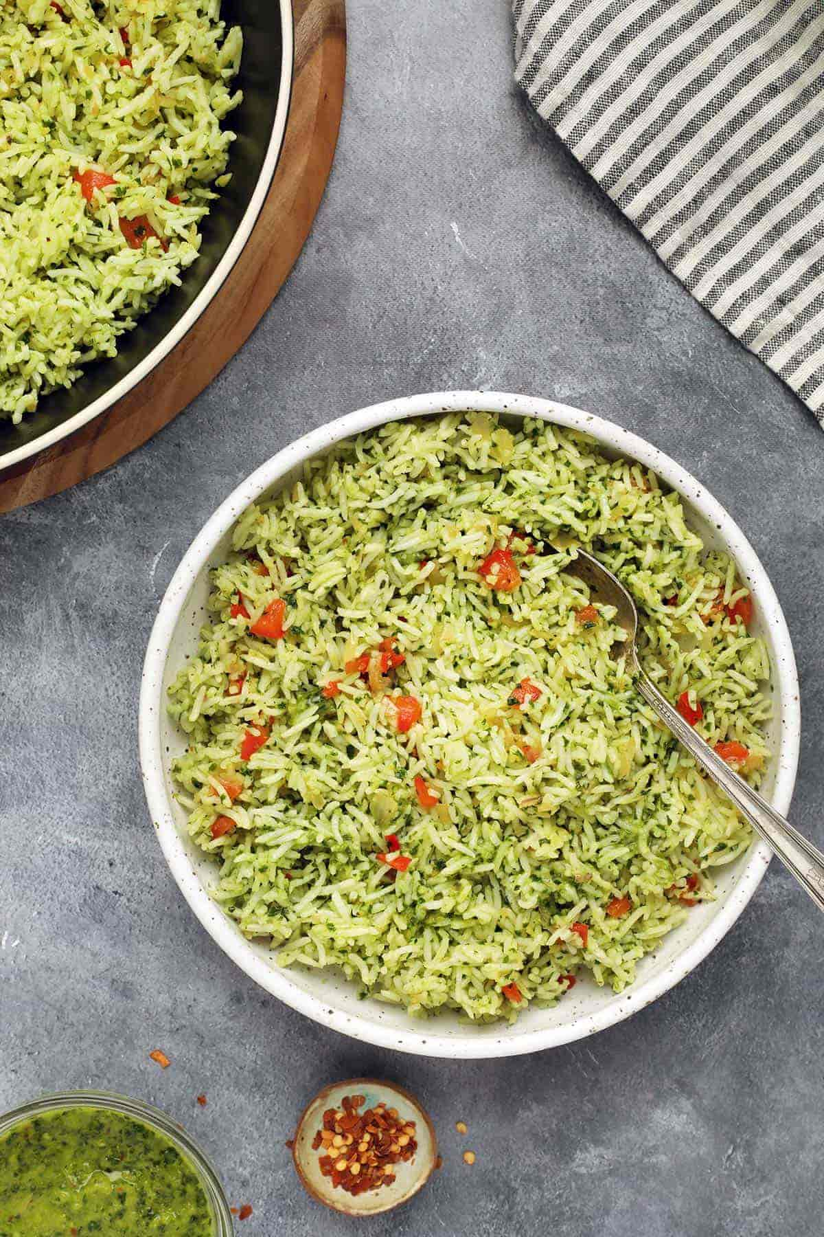 Bowl of chimichurri rice with a spoon.