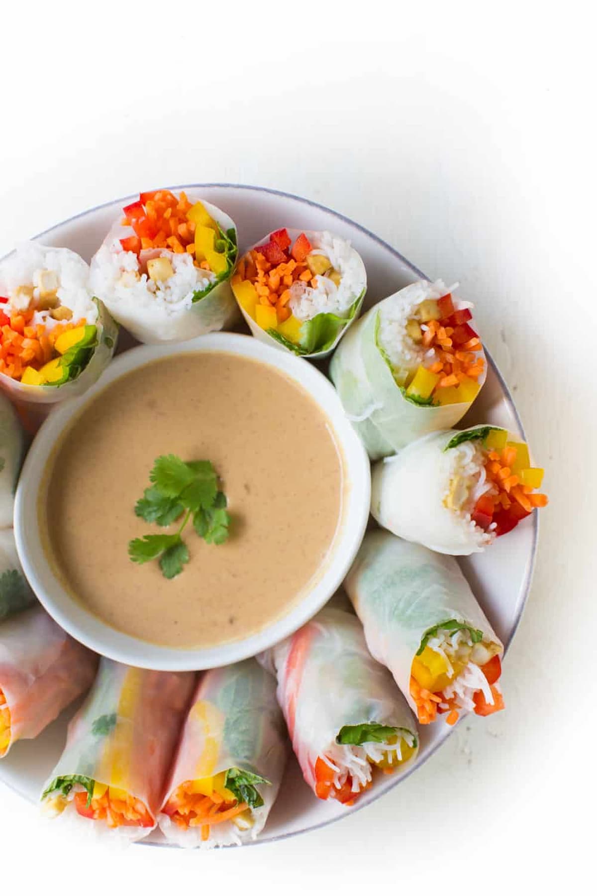 Creamy peanut dipping sauce served with fresh rainbow spring rolls. 