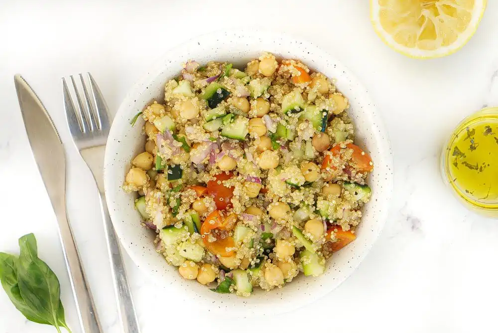 Chickpea Quinoa Salad With Tomatoes Cucumbers and a Lemon Olive Oil Vinaigrette.
