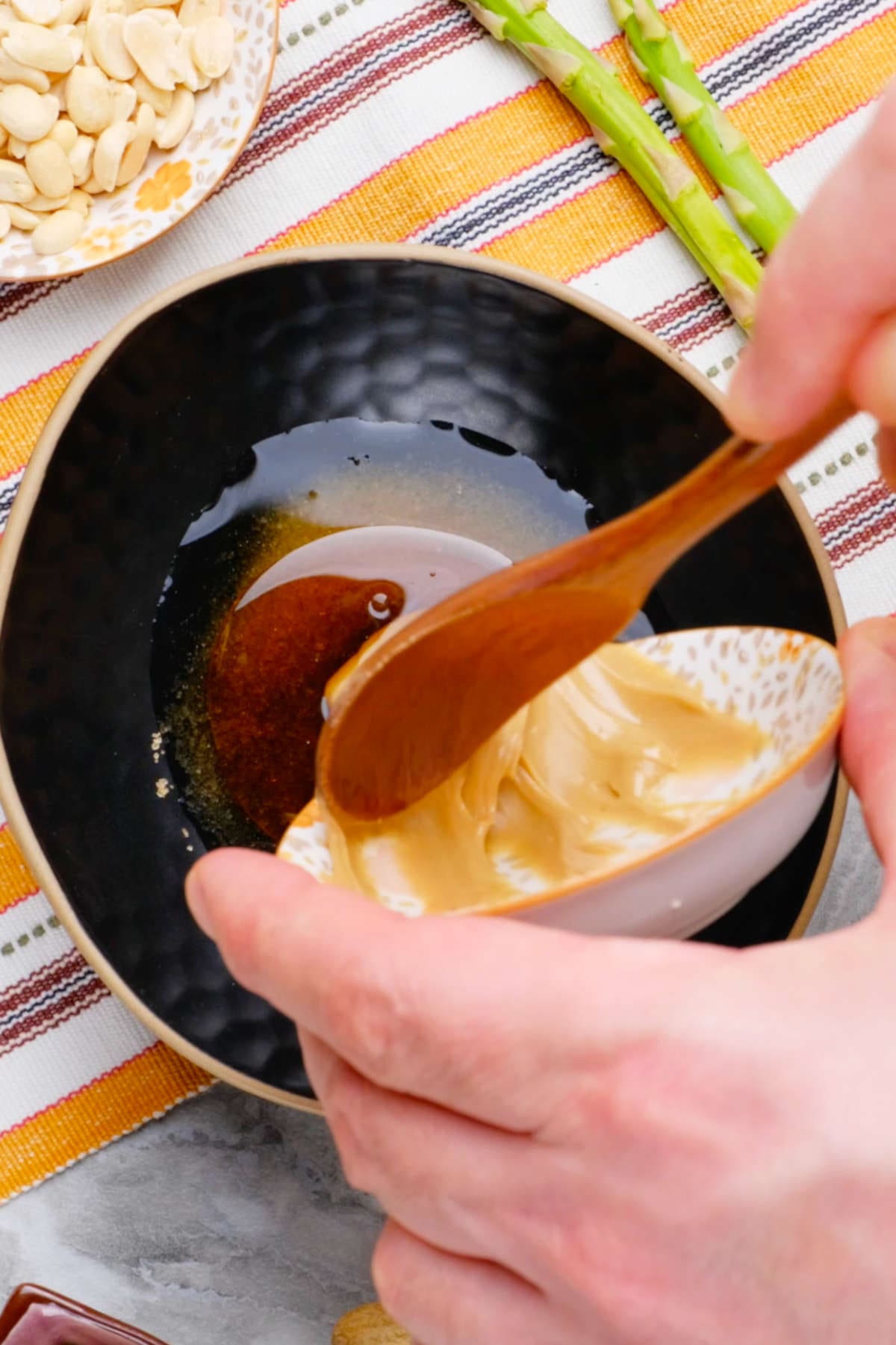 The stir fry peanut sauce being mixed together in a small bowl.