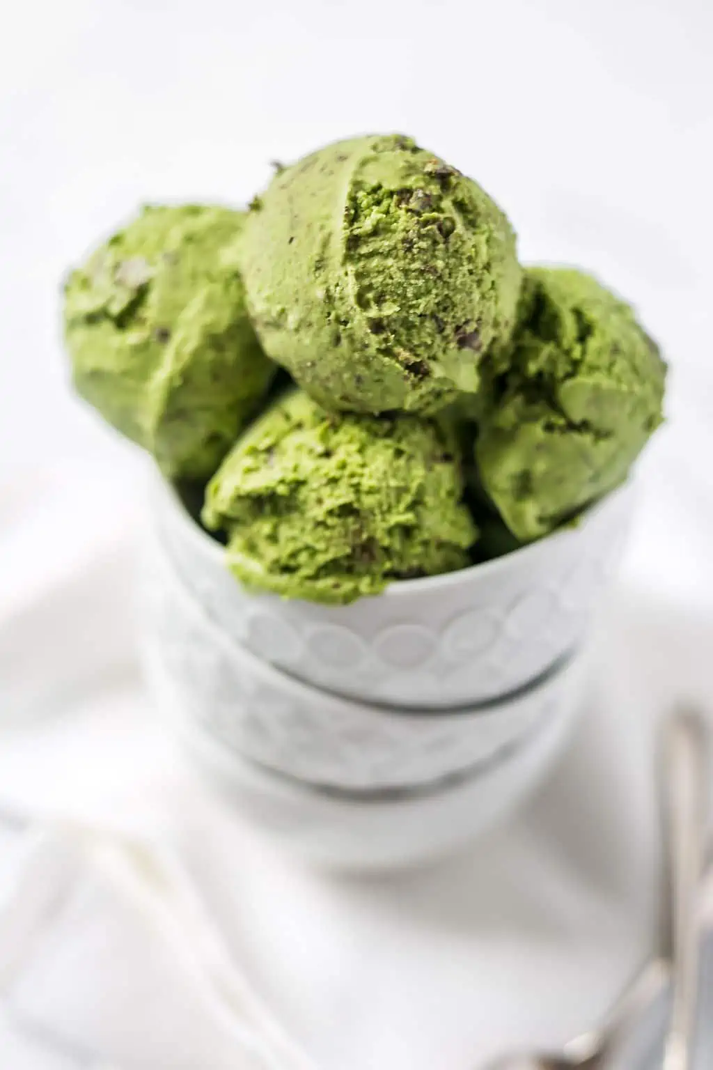 Several scoops of this Matcha Chip Plant Based Ice Cream Recipe in a bowl.