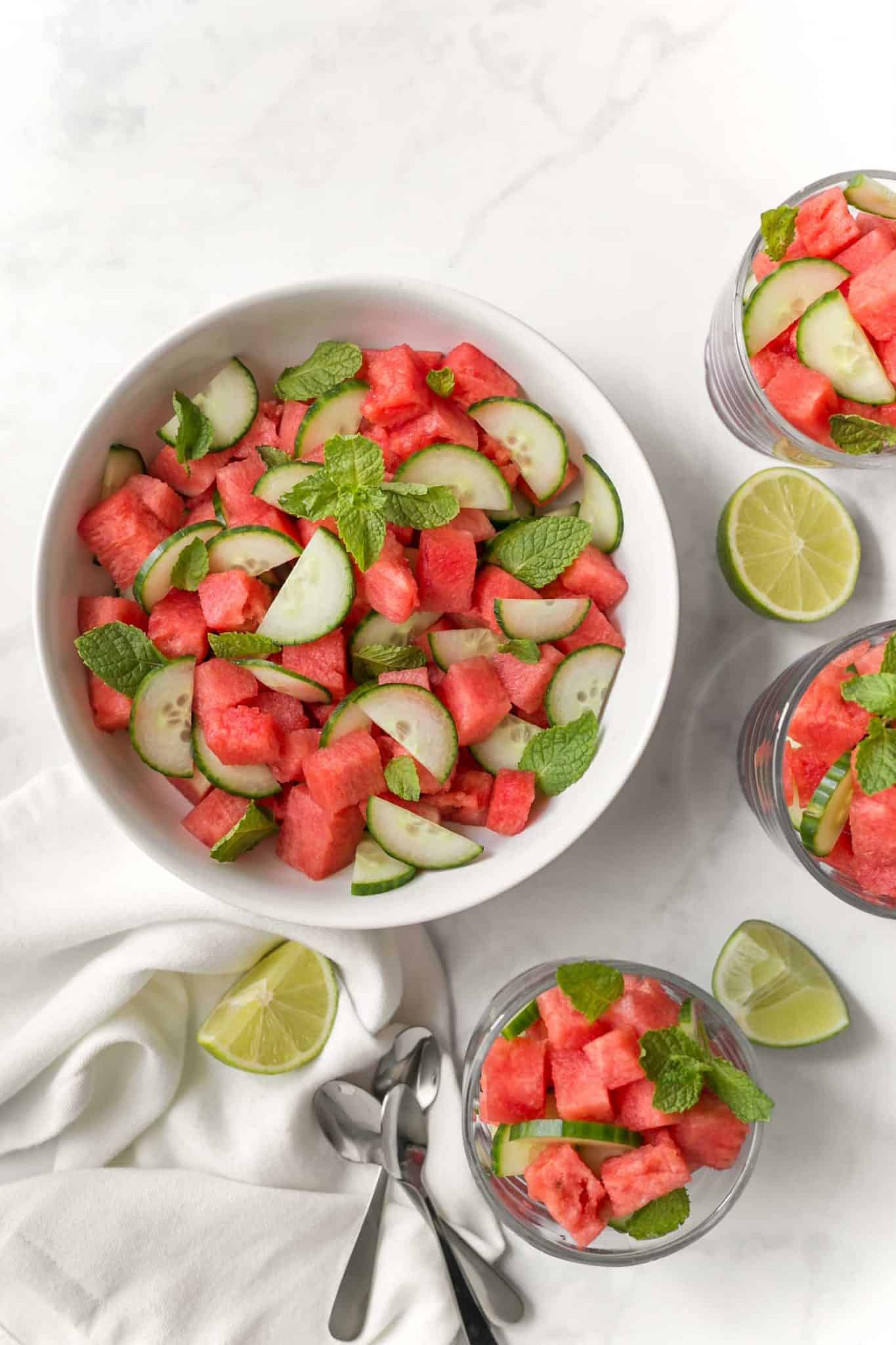 Easy Cucumber Melon Salad Served in Bowls With A Side of Lime