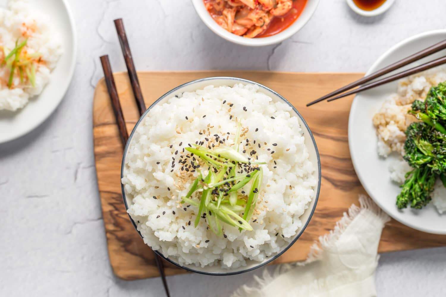 Hands cooking sticky rice with pot and rice steamer, traditional