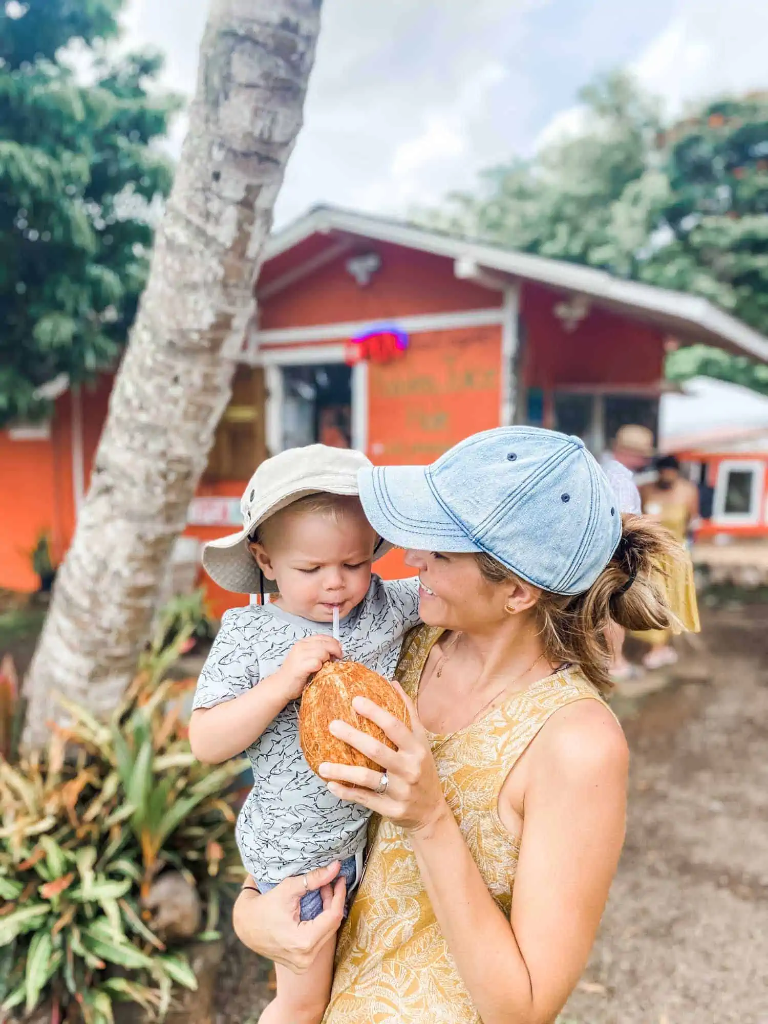 Michelle Cehn and Graham Miller Drinking a Fresh Coconut at Kalalei Juice Hale in Kauai