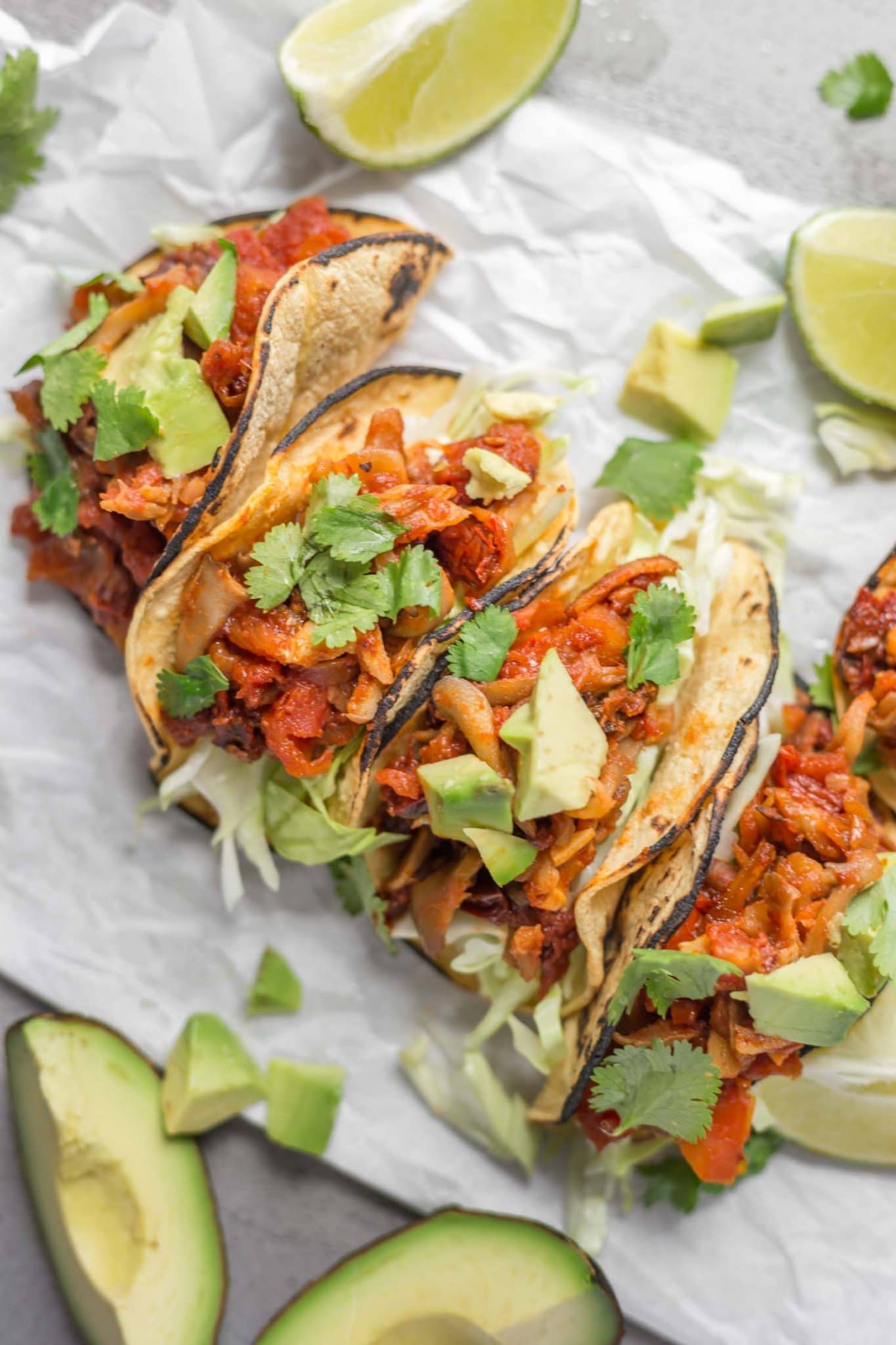 Vegan Mushroom Tacos With Avocado and Lemon Wedges