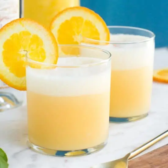 Dairy Free Orange Creamsicle Cocktails with Coconut Milk Garnished with an Orange Slice